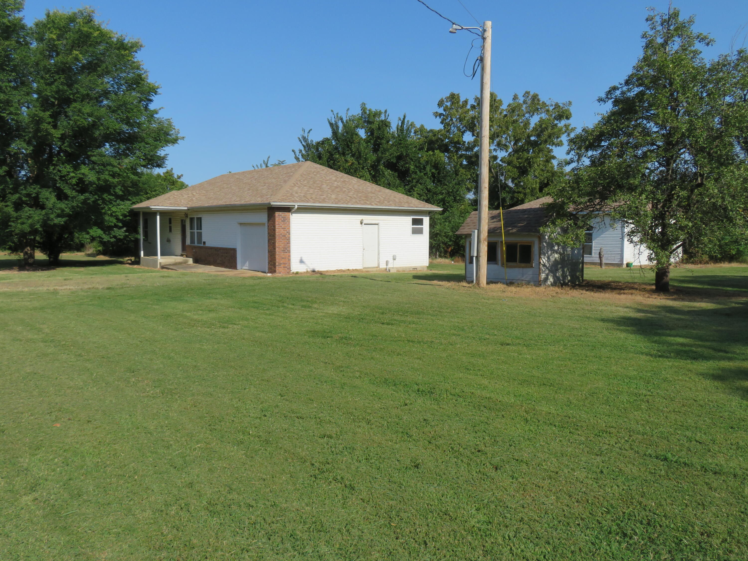 Photo 2 - Residential for sale – 411 E 330th Road  Humansville, MO